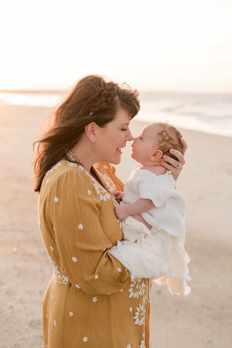 mommy and baby eskimo kissing, captured by destin florida family photographers