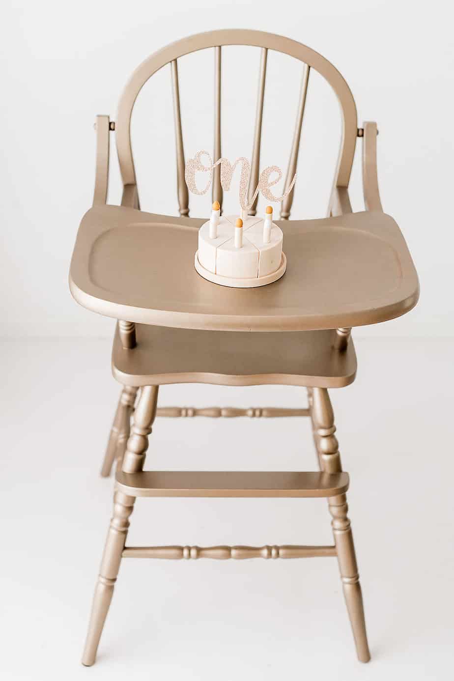wooden cake on gold high chair