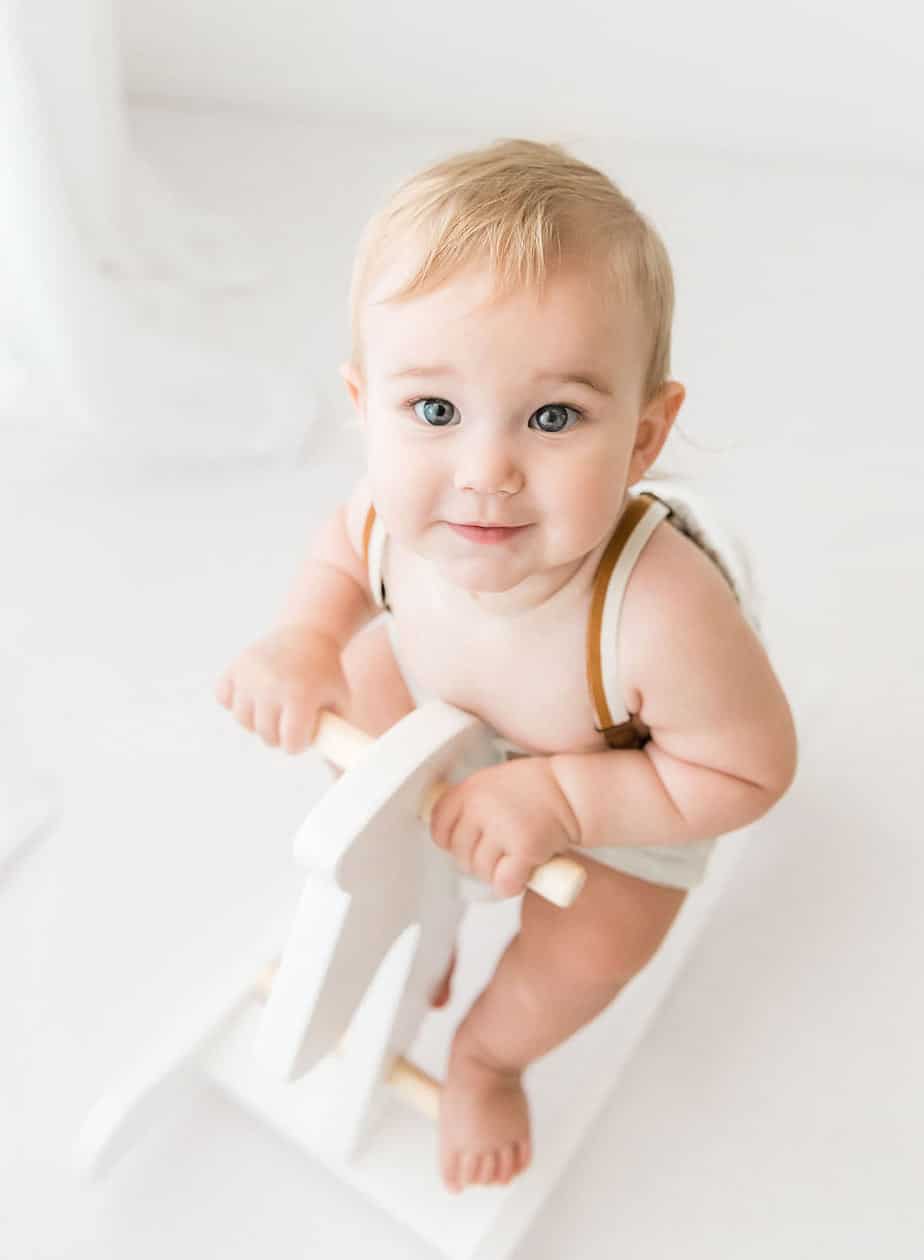 baby portrait on a rocking horse