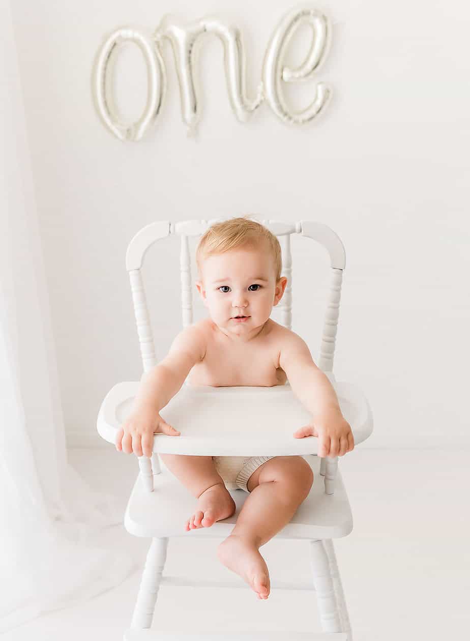 one year old boy in high chair