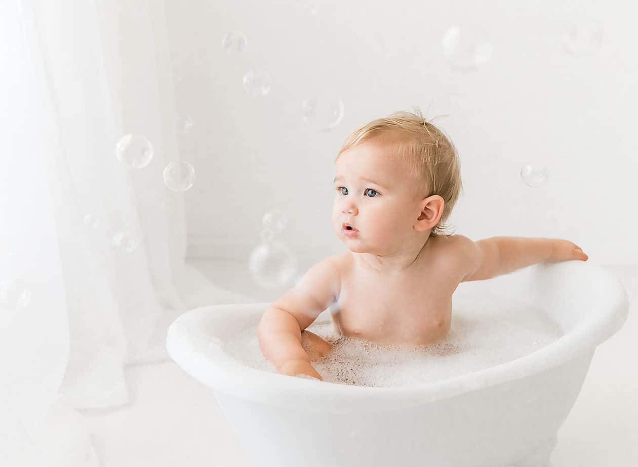 little boy in a bubble bath