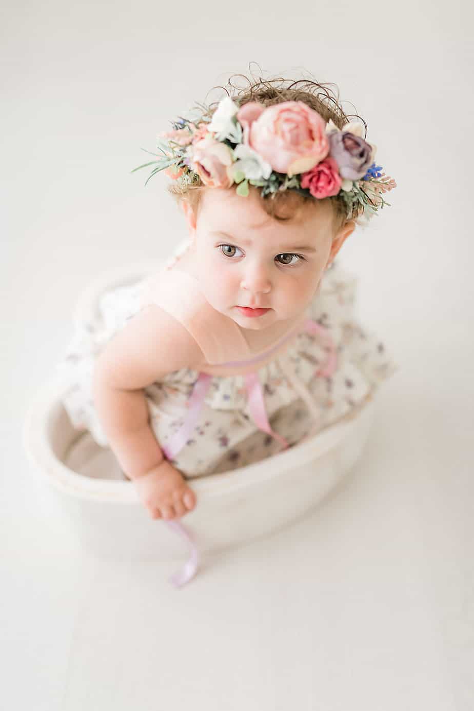 cute baby in a heart bowl