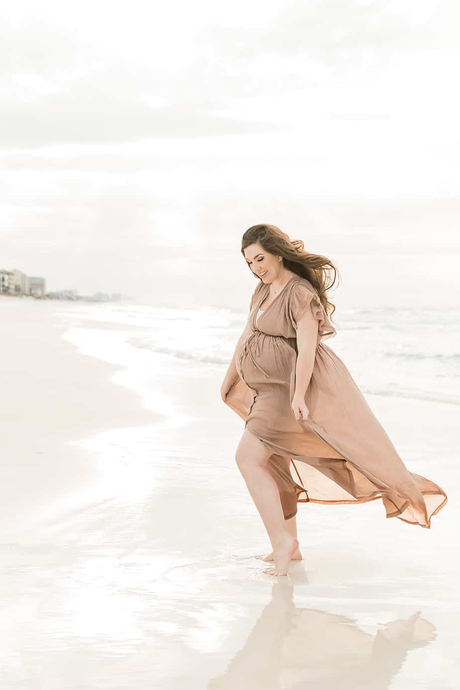 pregnant woman posing for Grayton beach photographers