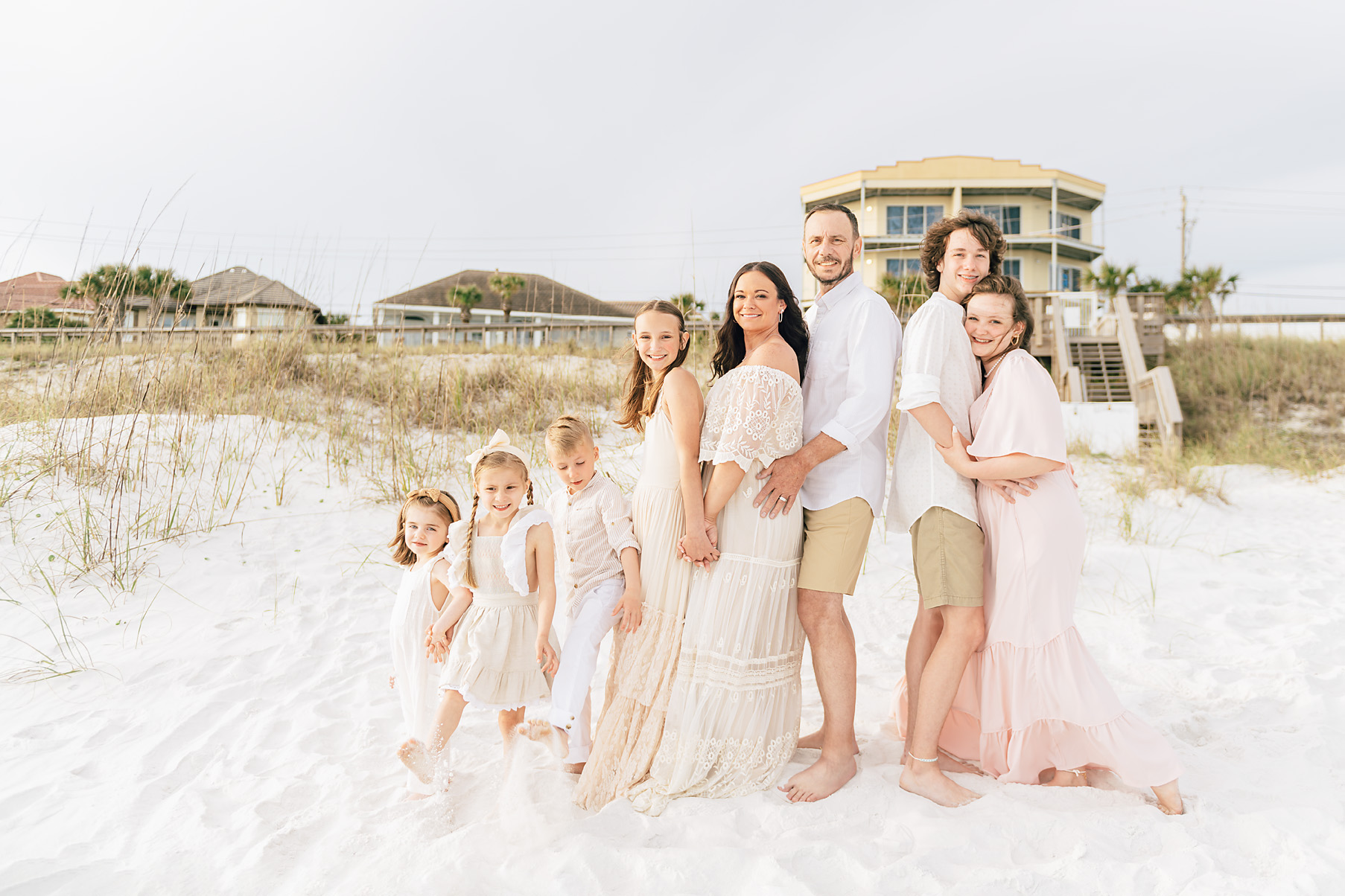 family in front of Miramar Beach Dunes