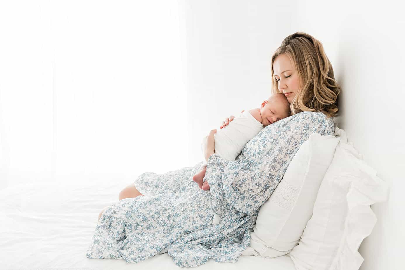 beautiful mom with her newborn photographed in a studio by 30a newb born photographer