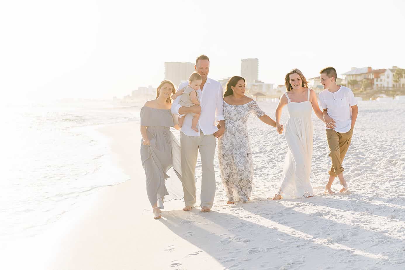 a happy family with their photographers in Crestview FL