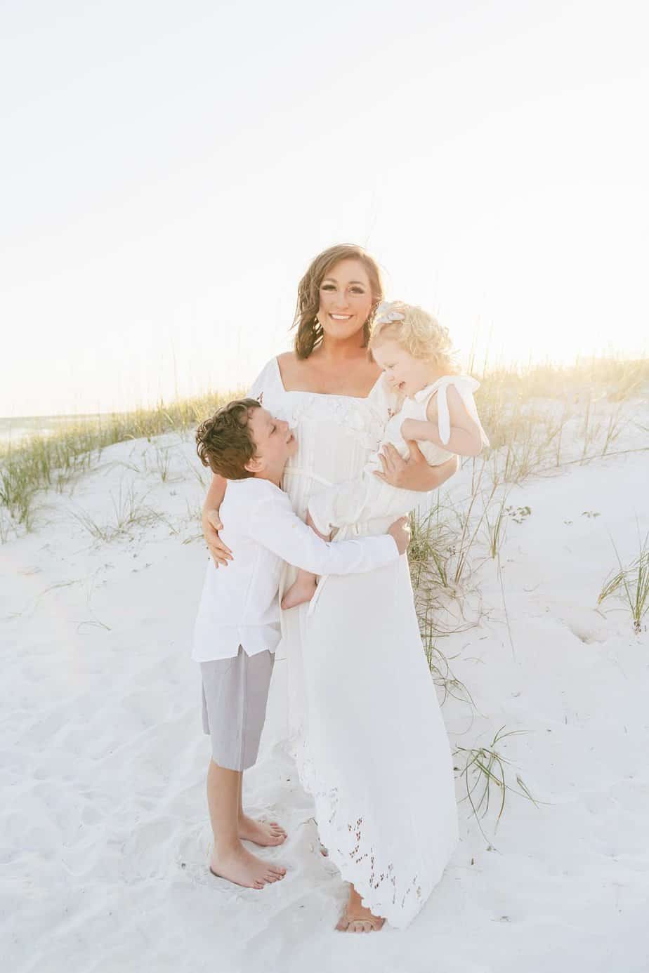 a mother and her children standing in the Fort Walton beach dunes
