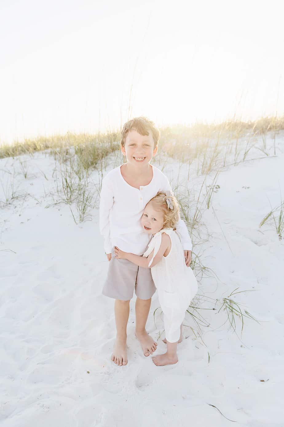 siblings holding each other with fort walton photography