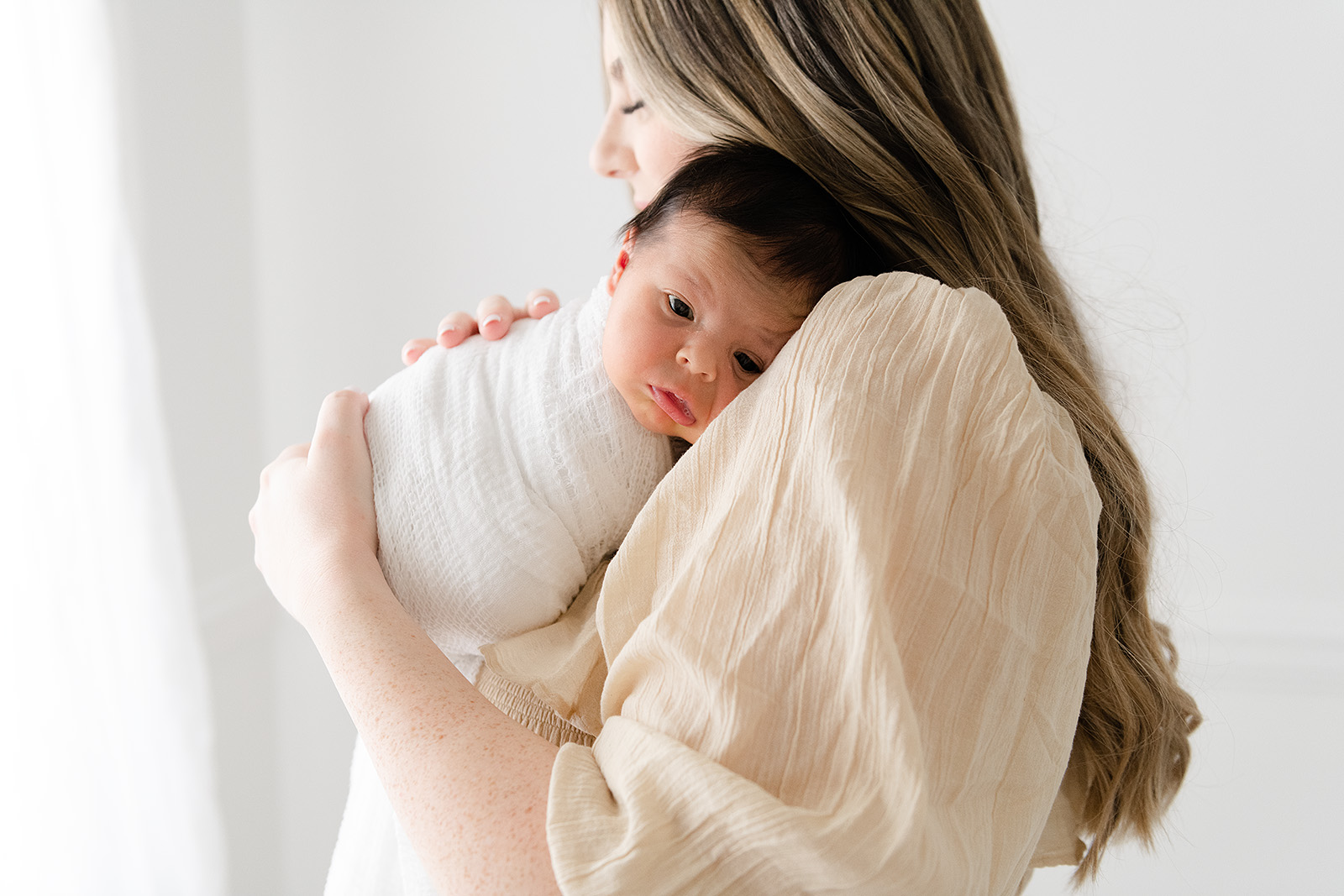 a newborn in her moms arm