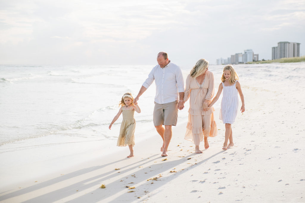 a family going for a beach walk