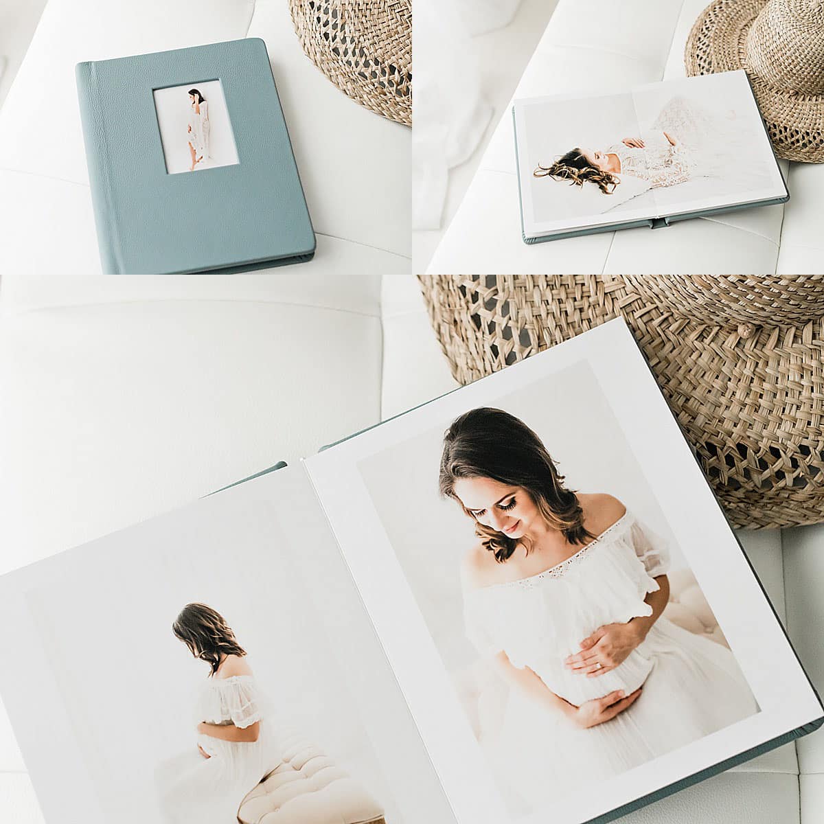 A photo album with maternity portraits on white pages, next to a woven hat on a white surface.