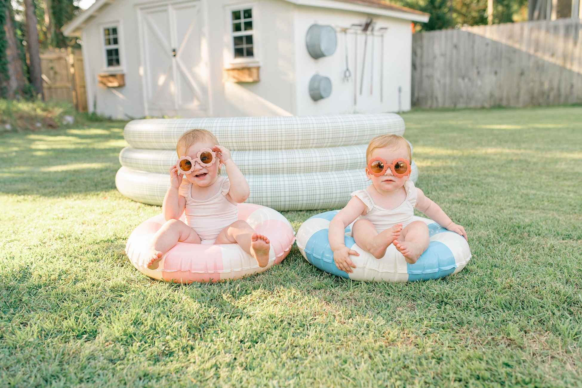 Destin mini session twin toddlers in floaties and sunglasses in Niceville studio backyard